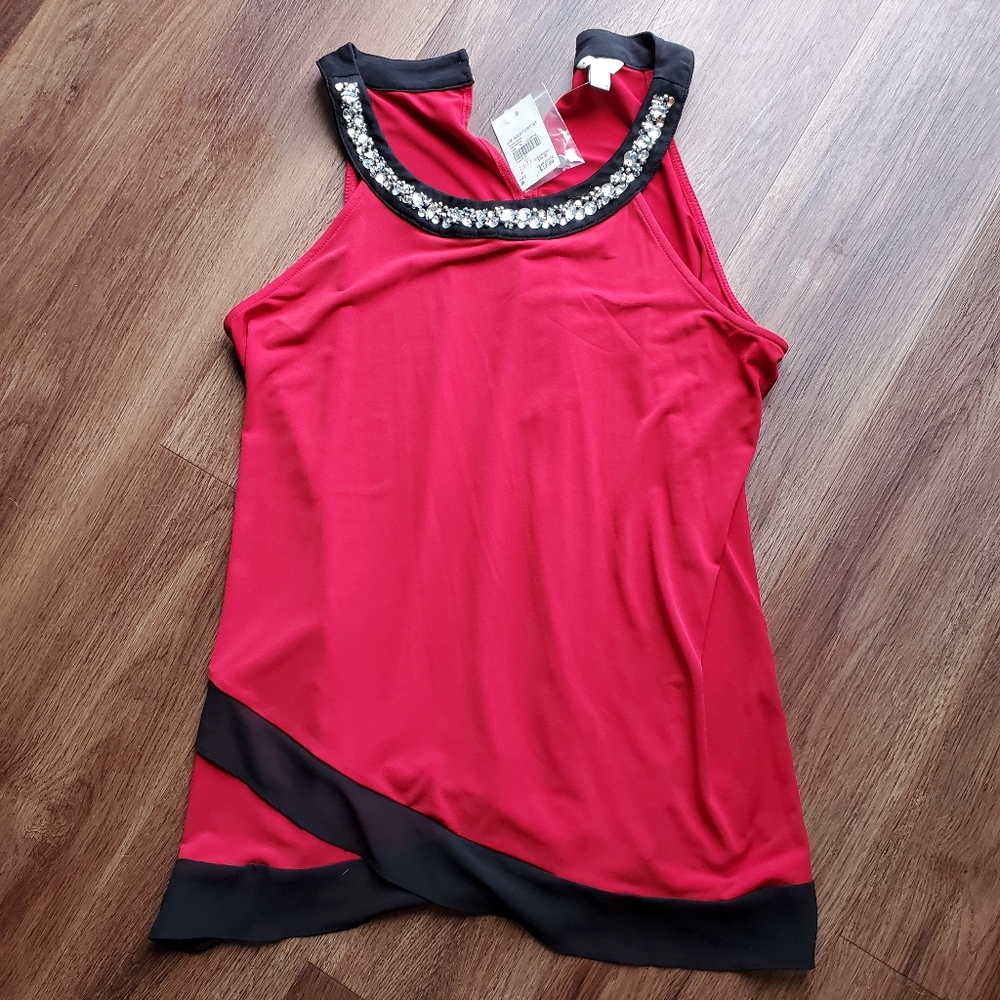 Cocktail blouse with jewel embellished neckline.